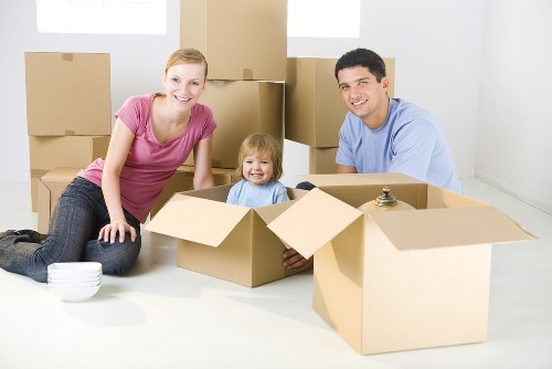 Mover carrying boxes for a Westkensington flat relocation