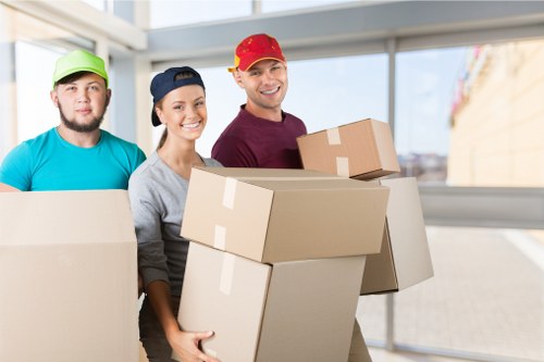 Professional office relocation team handling furniture and equipment in Westkensington