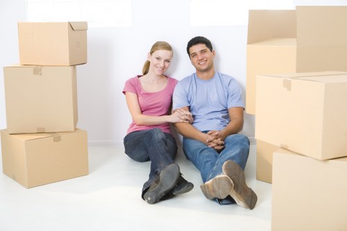 Furniture removals team preparing items in West Kensington