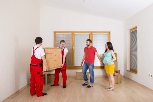 Professional man and van helping with a flat move in Westkensington