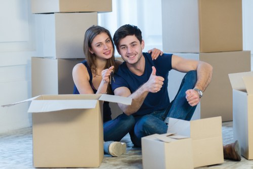 Packed boxes and furniture prepared for transport by movers