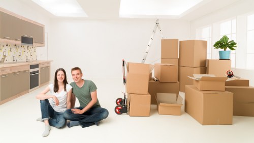 Packing and loading items into a van for a West Kensington move
