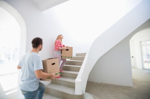 Local movers handling a staircase move in West Kensington