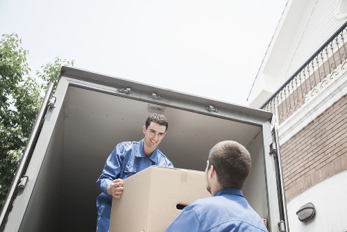 Professional man and van loading items in Westkensington