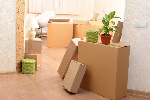 Movers assessing a property before lifting and transporting belongings