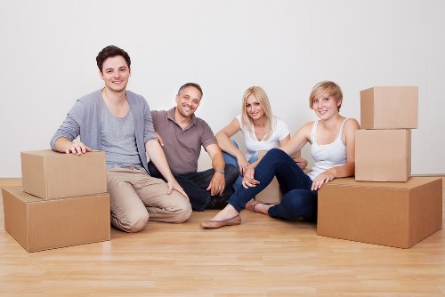 Professional moving staff preparing furniture for secure transport